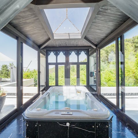 Relax and unwind after a day of exploring in the hot tub with views of the sky above you