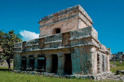Explore ancient Mayan temples overlooking the Caribbean Sea, an eight-minute drive