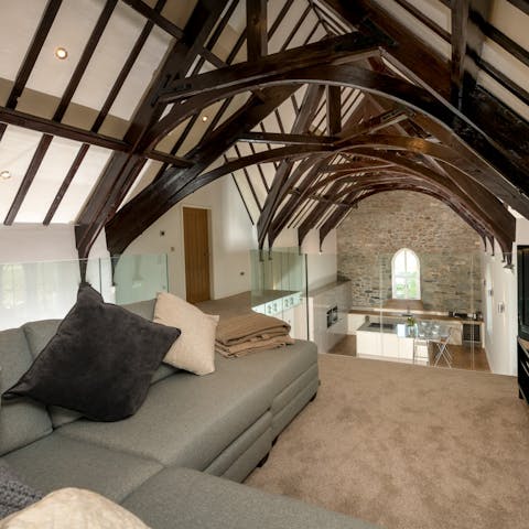 Cosy up in the snug raised living area while admiring the stunning architecture