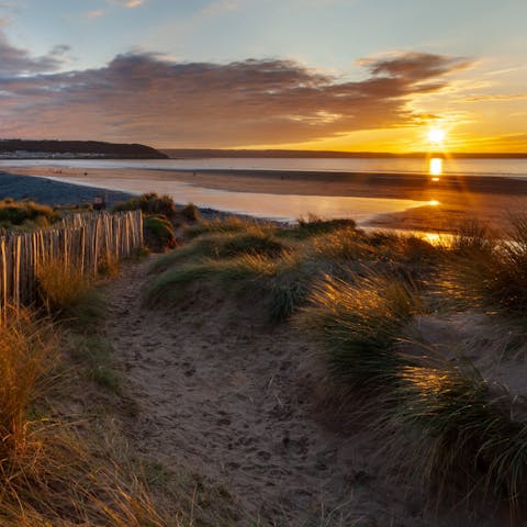 Catch a gorgeous sunset at Westward Ho! Beach, a fifteen-minute walk away