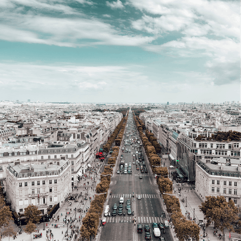 Explore the luxury shops of Champs-Élysées,  a fourteen-minute walk away