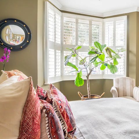 The beautifully dressed master bedroom
