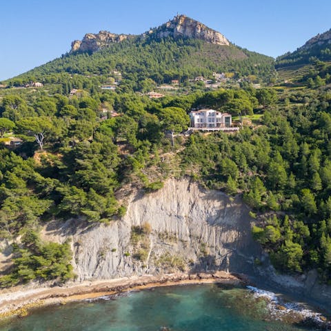 Walk seven minutes down a private path to Plage de l’Arène