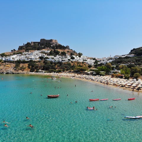 Visit the town of Lindos and its clifftop acropolis, a ten-minute drive away