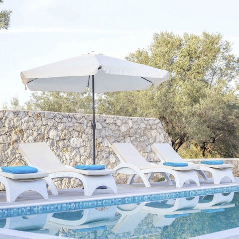 Swim laps of the pool or lounge poolside in the sun