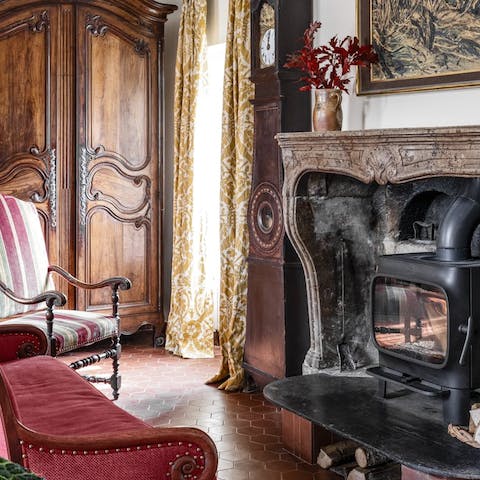 Cosy up by the woodburner fireplace on chilly evenings