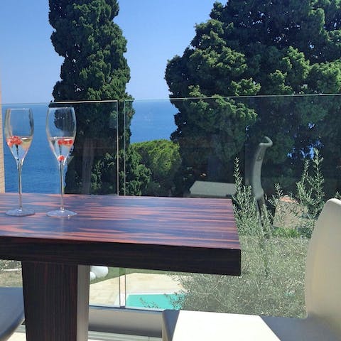 Admire the Mediterranean sea views with a glass of Sicillian rosé
