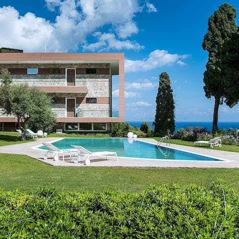 Soak up the Sicilian sun next to the shared pool