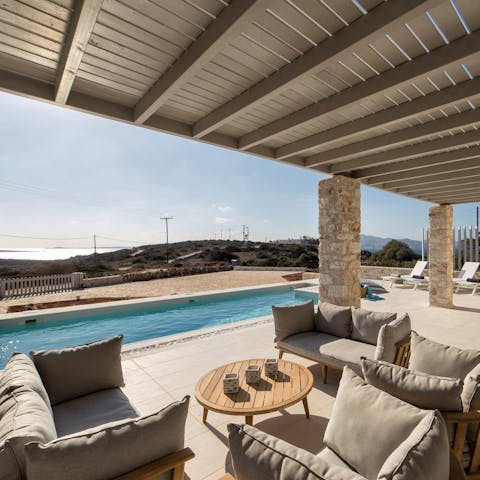 Lounge around on the cosy chairs with some cocktails
