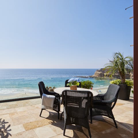 Enjoy the waterfront views from the balcony as you sip a glass of wine
