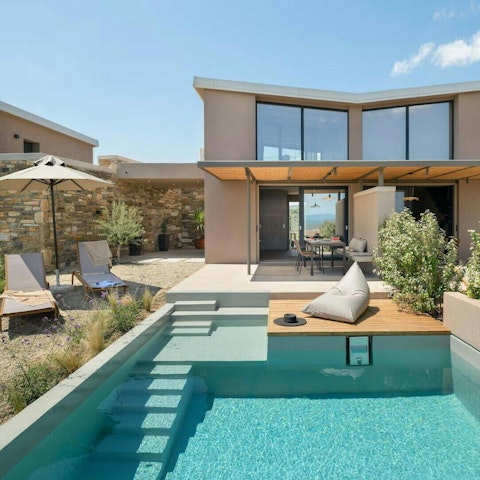 Lounge by the pool with a drink in hand