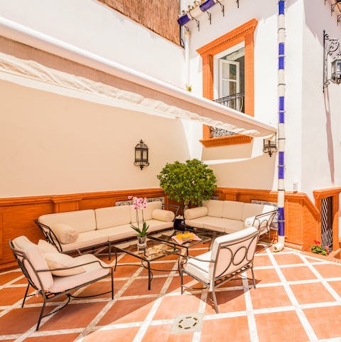 Enjoy a shady spot under the canopy, and sip a coffee on the outdoor sofa