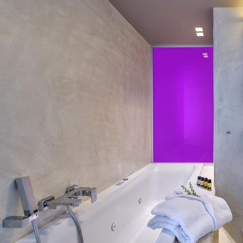 Relax amidst the coloured dimmer lights which create a calming ambience in the jacuzzi bath tub