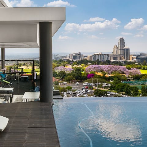 Take a refreshing dip in the communal infinity pool and enjoy the view