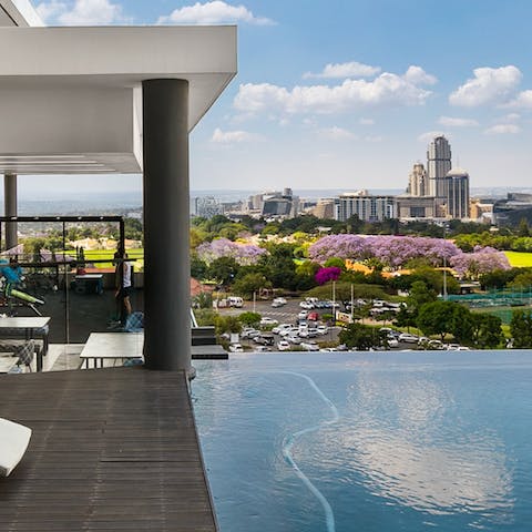Take a refreshing dip in the communal infinity pool and enjoy the view
