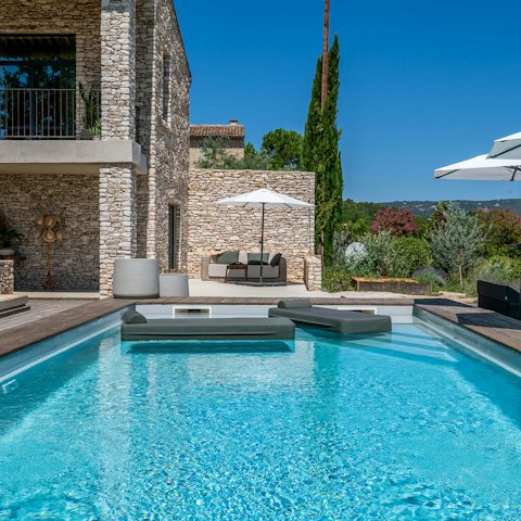Relax on a floating lounger in the private pool