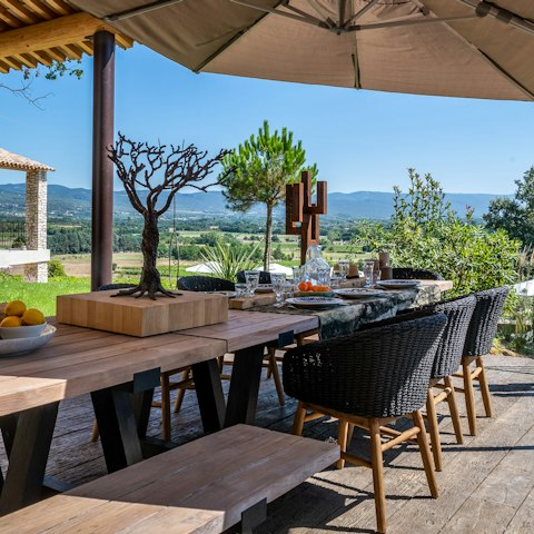 Admire views of the Provençal countryside as you dine alfresco