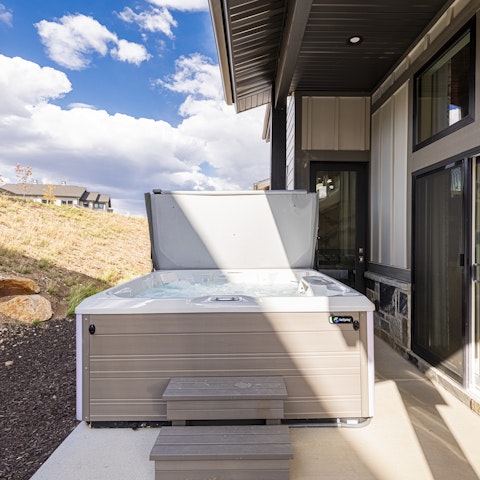 Unwind sore muscles in the private hot tub