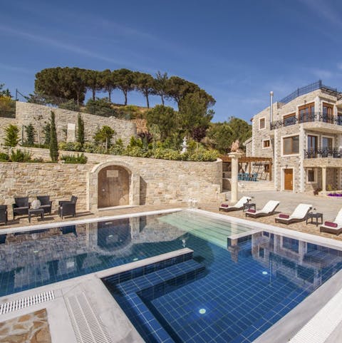 Spend days by the poolside in the grand, terraced gardens