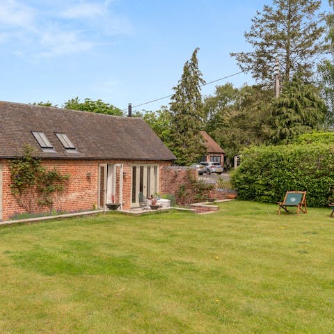 Enjoy afternoon tea on the sunny patio as the kids and pups play in the garden