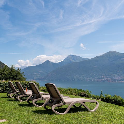 Lounge in the sun with lake and mountain views