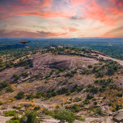 Explore the rugged beauty of Enchanted Rock State Natural Area, a ninety-minute drive