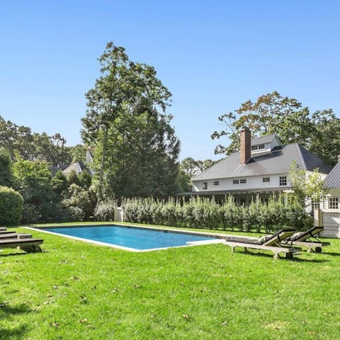 Stretch out poolside in the tranquil gardens