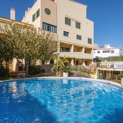 Take advantage of the gorgeous weather with an afternoon dip in the communal swimming pool