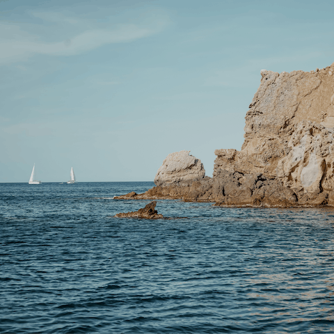 Visit Javea's two beautiful beaches – Platja de l'Arenal has sand while Cala Blanca is rocky