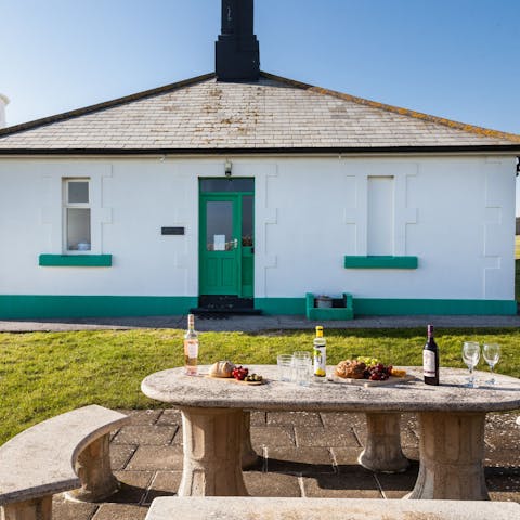 Lay the table for an alfresco meal in the private side garden