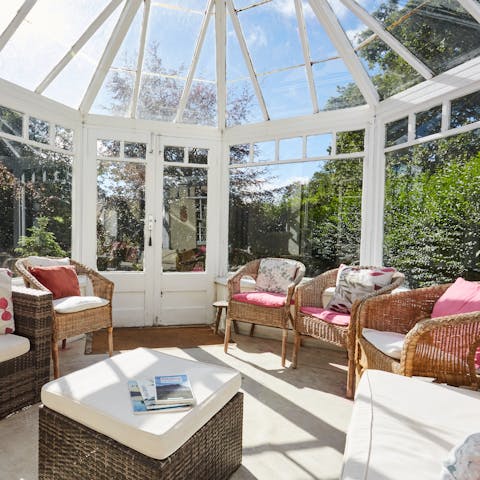 Bird watch even when it rains with the huge conservatory