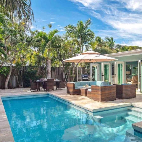 Spend your days lapping up the sun beside the pool