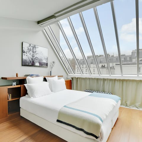 Wake up to Montmartre views through the glass roof