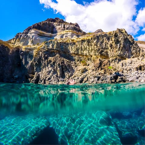 Visit Pantelleria's rocky coastline and underwater caves