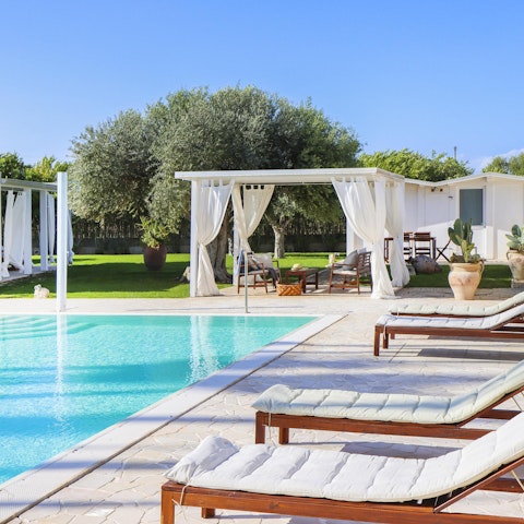 Experience total relaxation while lounging by the pool