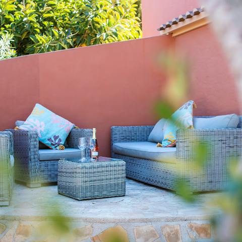 Enjoy evening cocktails and a card game at the outdoor sofas