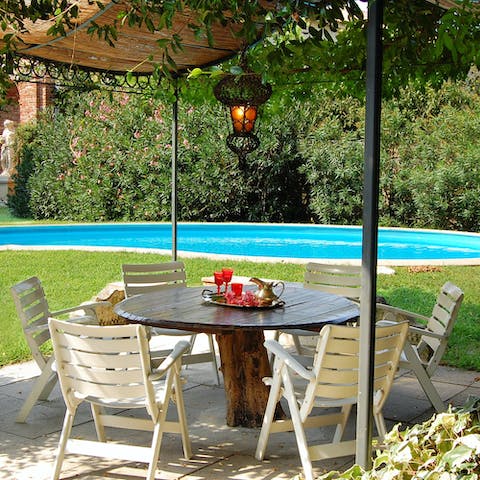 Enjoy a refreshing drink under the shade of the covered patio