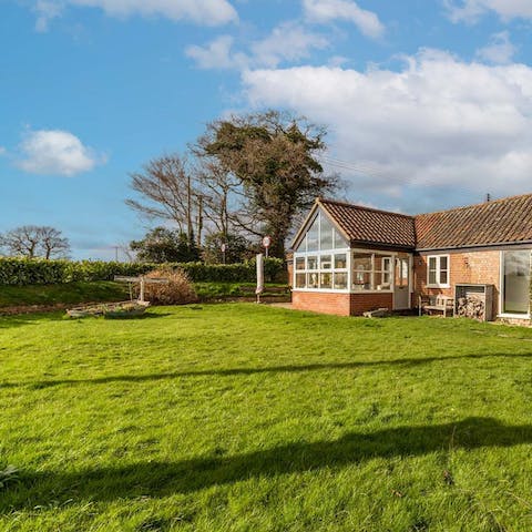 Let the kids have fun playing on the lawn while you relax in the fresh air