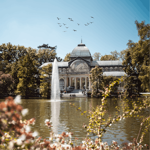 Go boating in El Retiro Park, just a twelve-minute walk away