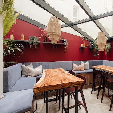 Enjoy a cup of coffee in the vibrant, communal lounge