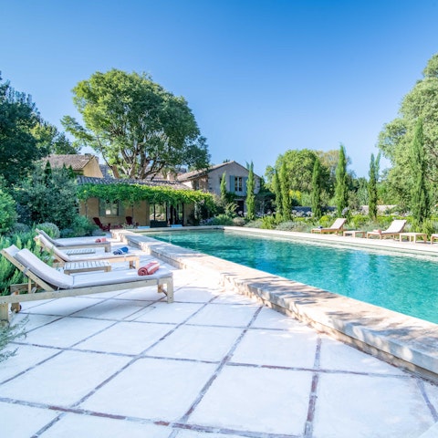 Relax in the sunshine beside the picturesque pool