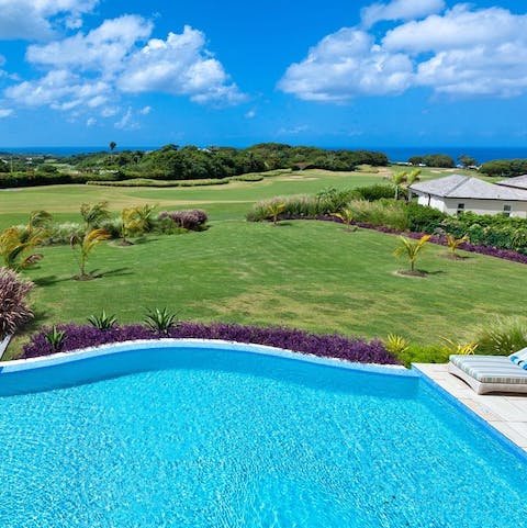 Swim up to the edge of the private infinity pool and enjoy the rolling green golf course views