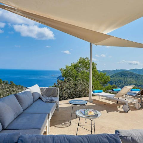 Sip a cocktail while you enjoy the breathtaking view  of the Balearic Sea
