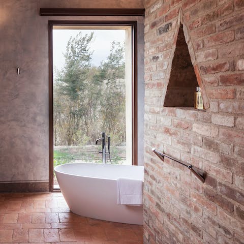Unwind with a bubble bath in the lavish soaker tub