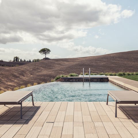 Enjoy uninterrupted views while relaxing by the pool