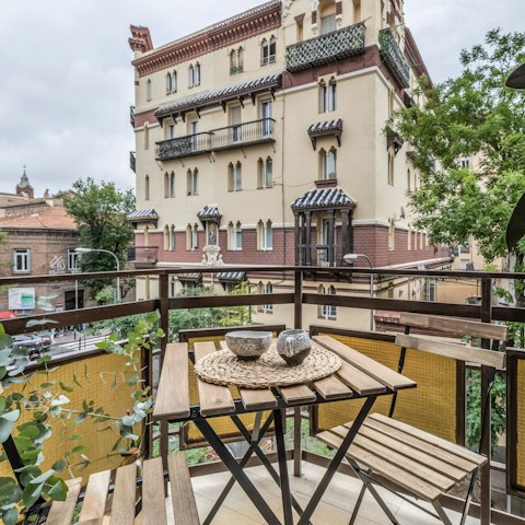 Sip coffee on the private balcony as Madrid wakes below