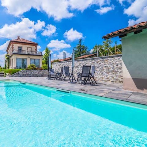 Have a relaxing dip in the pool and dry off with a drink at the nearby table