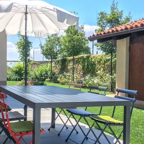 Dine alfresco with an afternoon charcuterie board and a cocktail