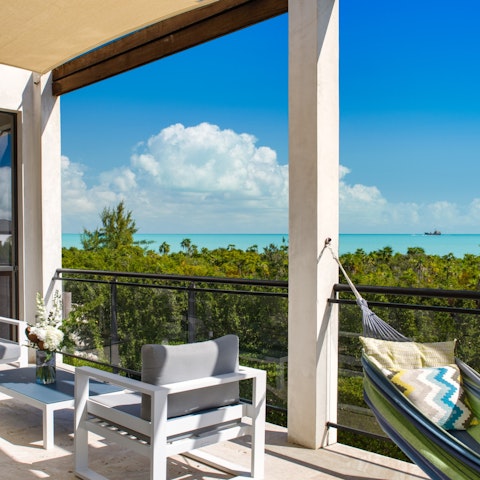 Relax on the balcony as turquoise water stretches to the horizon