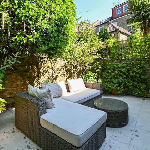 Spend a lazy afternoon curled up with a good book in the private courtyard